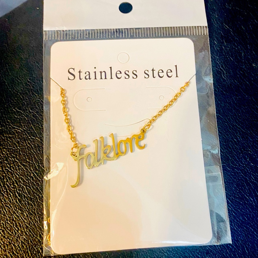 New. FOLKLORE Taylor Swift album necklace. Stainless steel in gold.